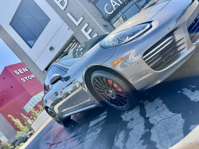 Porsche at the Bubbles Car Wash storefront